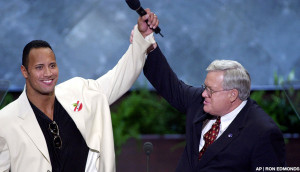 House Speaker Dennis Hastert, R-Ill., and World Wrestling Federation champion, The Rock, raise their hands at the podium at the Republican National Convention in Philadelphia, Wednesday, Aug. 2, 2000. (AP Photo/Ron Edmonds)